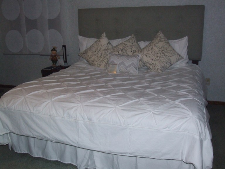 A cozy bed at LaRose Wellness retreat in Michigan's Keweenaw Peninsula is just the place to relax and rejuvenate.